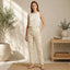 C.Wonder beige floral and insect ankle pants