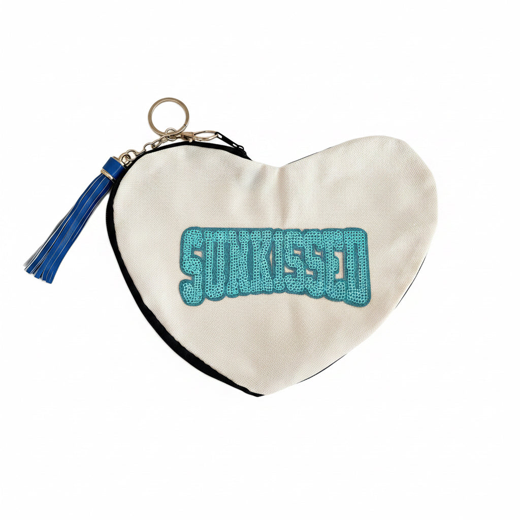 Sunkissed sequin heart-shaped canvas pouch with tassel accent