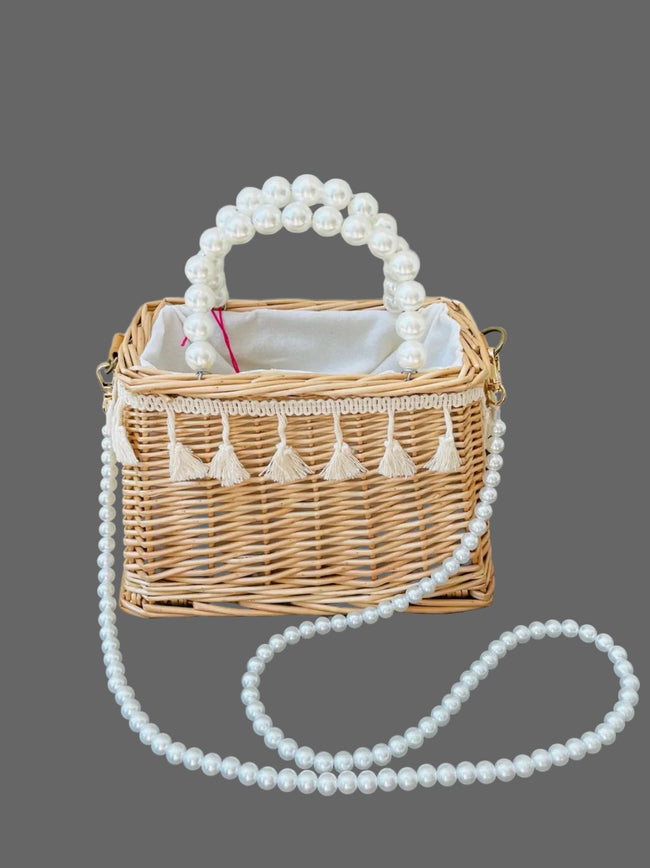 Woven straw basket purse with fringe accent and pearl handles Hover Image