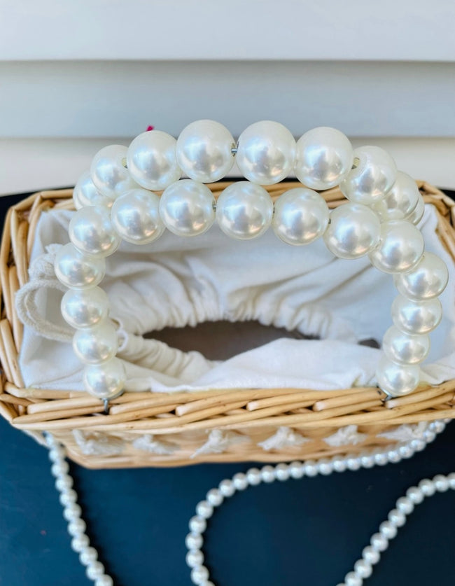 Woven straw basket purse with fringe accent and pearl handles Main Image